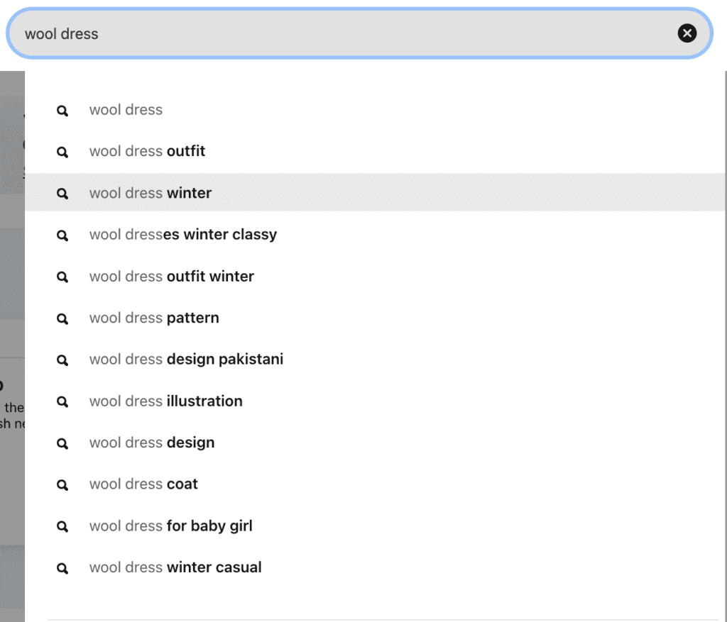 Screenshot of the words "wool dress" in Pinterest's search bar with a drop-down menu of search suggestions starting with "wool dress."